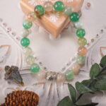 Cherry Blossom Agate bracelet displayed in a soft, natural setting, highlighting its feminine and gentle energy.