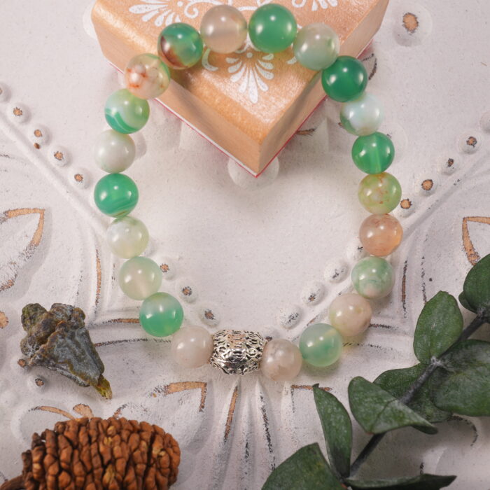 Cherry Blossom Agate bracelet displayed in a soft, natural setting, highlighting its feminine and gentle energy.