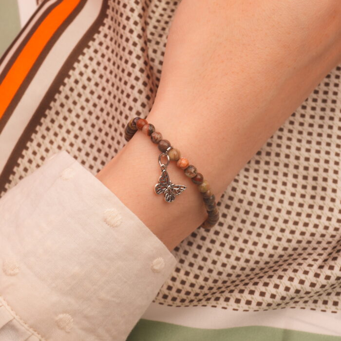 Model wearing jasper gemstone bracelet with Picture Jasper beads
