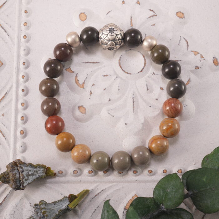 Landscape Stone S925 Stability Bracelet placed on a textured surface, showcasing its grounding energy