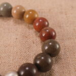 Close-up of genuine landscape stone beads with durable S925 sterling silver accents