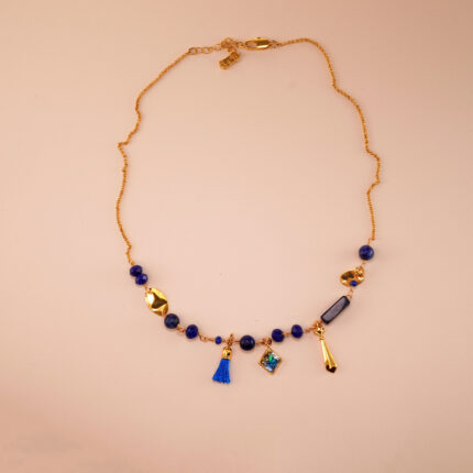 Handmade lapis lazuli pendant necklace centered on a neutral background