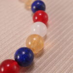 Close-up of Handmade Lapis Lazuli, Red Agate, Citrine & White Chalcedony beads with S925 sterling silver accents