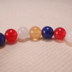 Close-up of Handmade Lapis Lazuli, Red Agate, Citrine & White Chalcedony beads with S925 sterling silver accents