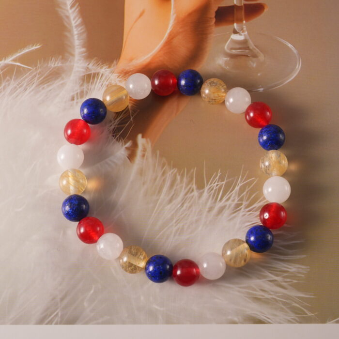 andmade Lapis Lazuli, Red Agate, Citrine & White Chalcedony S925 Bracelet placed on a textured surface