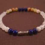 Close-up view of polished 4mm beads in deep blue, white, and pale green