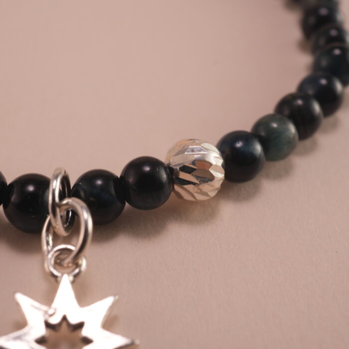 Close-up of Blue Tiger Eye Beads and Sterling Silver Charm – 4mm Gemstone Bracelet