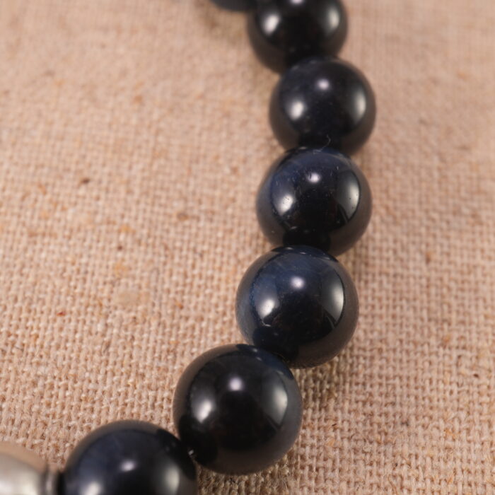 Close-up of Blue Tiger Eye Beads and Fish Charm – 8mm Gemstone Bracelet for Clarity and Energy