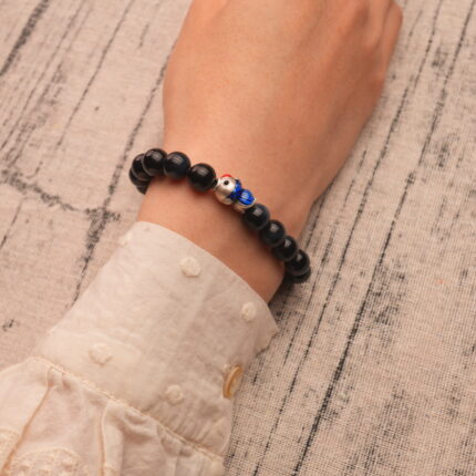 Wearing Blue Tiger Eye Bracelet with Silver Fish Charm – 8mm Crystal Jewelry for Calm and Strength
