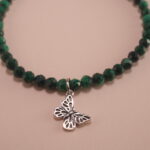Close-up of Malachite and Rhodochrosite Beads with Butterfly Charm – Healing Crystal Bracelet