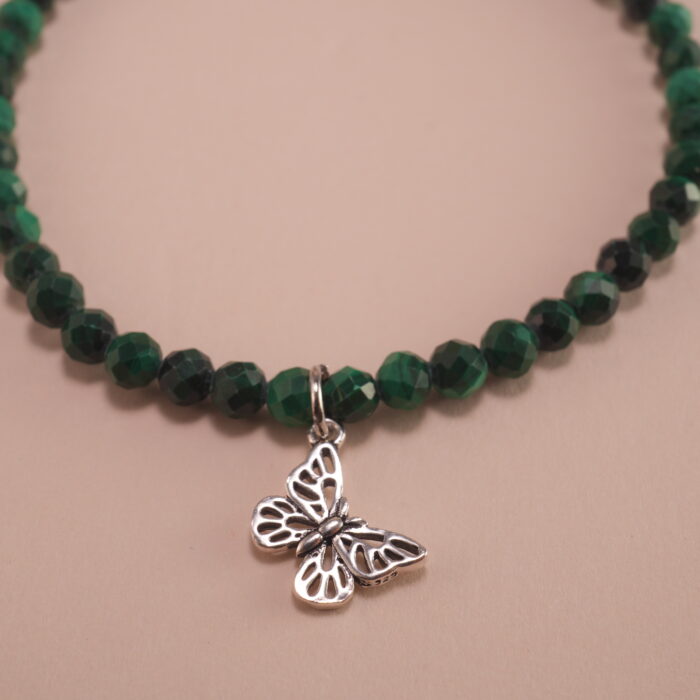 Close-up of Malachite and Rhodochrosite Beads with Butterfly Charm – Healing Crystal Bracelet