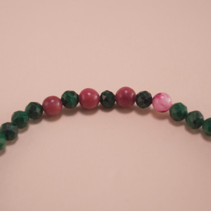 Close-up of Malachite and Rhodochrosite Beads with Butterfly Charm – Healing Crystal Bracelet