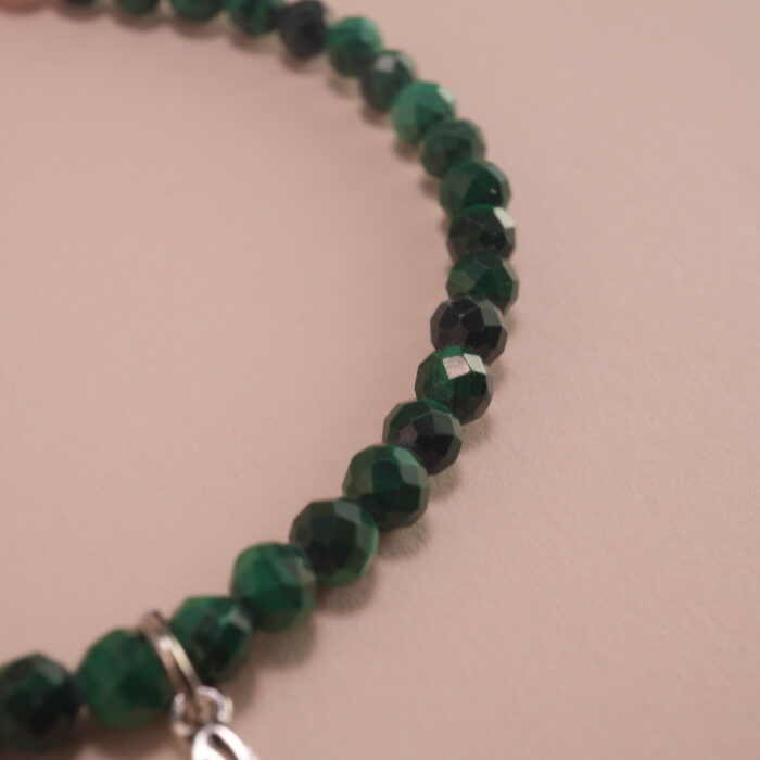 Close-up of Malachite and Rhodochrosite Beads with Butterfly Charm – Healing Crystal Bracelet