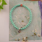 Turquoise & agate bracelet styled on soft fabric or natural surface