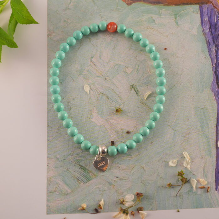 Turquoise & agate bracelet styled on soft fabric or natural surface