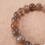 Close-up of glowing sunstone beads and silver detailing