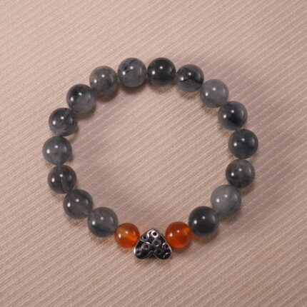 Gray rutile agate and rutile quartz 10mm protection bracelet with silver clasp on neutral background.
