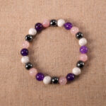 Obsidian, Amethyst, and Howlite 8mm gemstone bracelet displayed on neutral background.