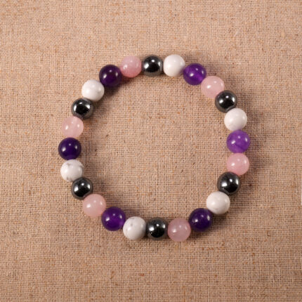 Obsidian, Amethyst, and Howlite 8mm gemstone bracelet displayed on neutral background.