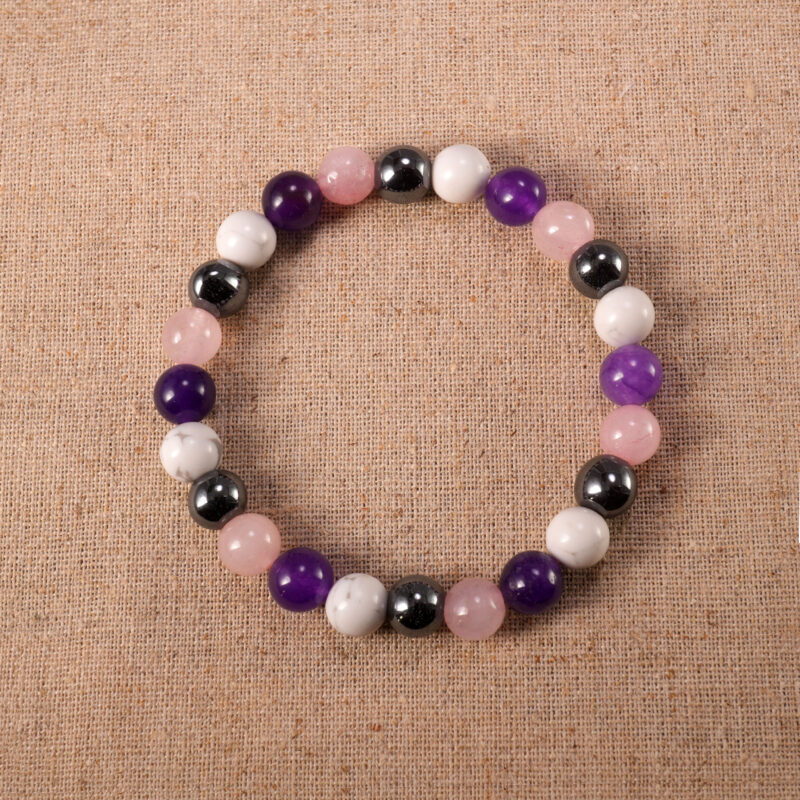 Obsidian, Amethyst, and Howlite 8mm gemstone bracelet displayed on neutral background.