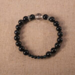 Obsidian and clear quartz 8mm gemstone bracelet on white background