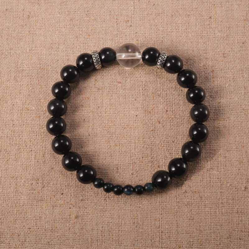 Obsidian and clear quartz 8mm gemstone bracelet on white background