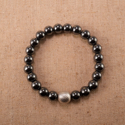 Hematite, aventurine, and black tourmaline bracelet on white background