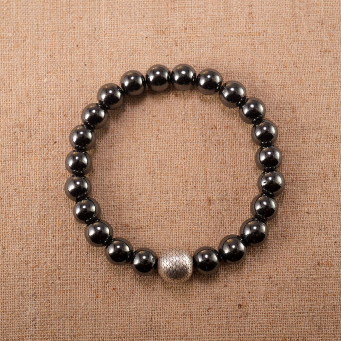 Hematite, aventurine, and black tourmaline bracelet on white background