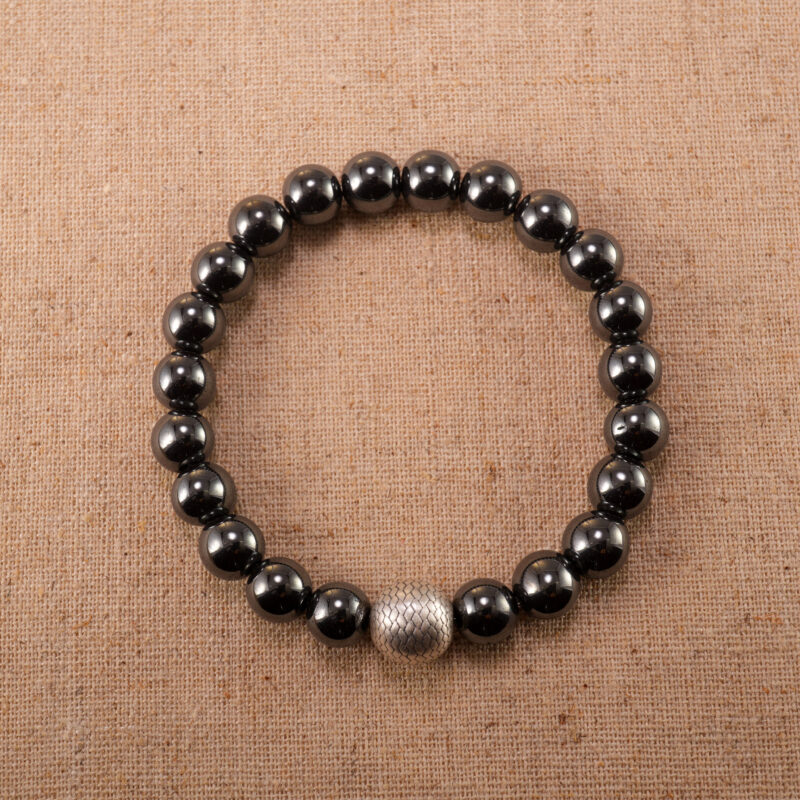 Hematite, aventurine, and black tourmaline bracelet on white background