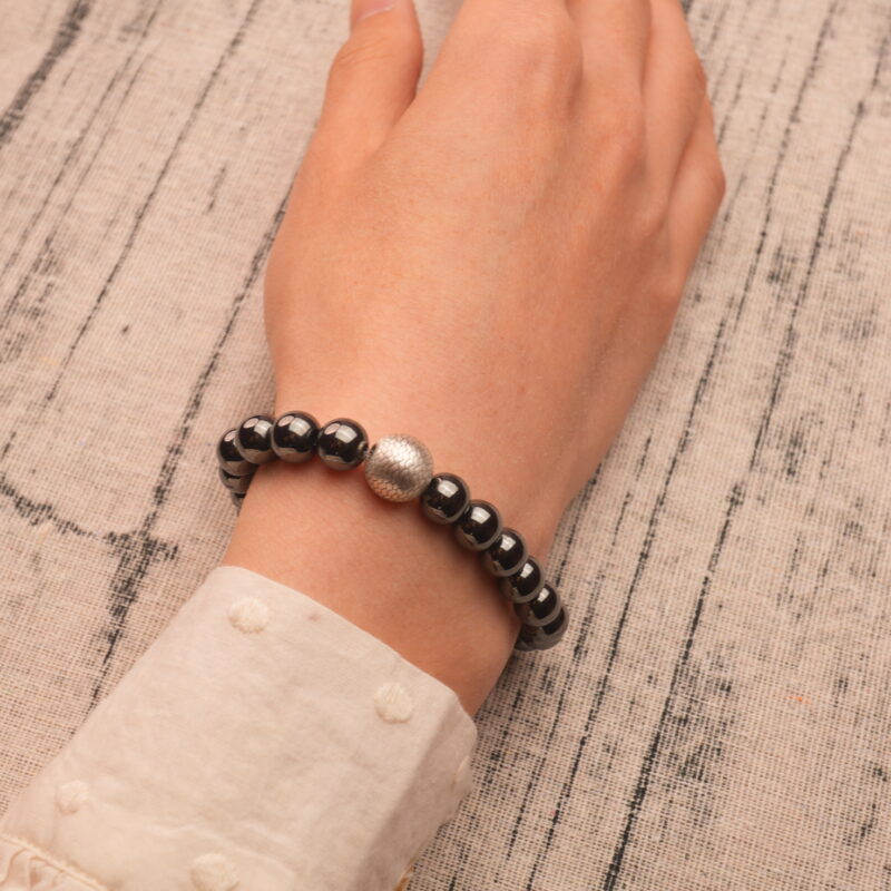Bracelet worn on wrist with neutral clothing, showing minimalist daily style