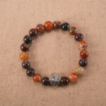 Handcrafted gemstone bracelet with Phantom Quartz beads and S925 silver clasp on clean background