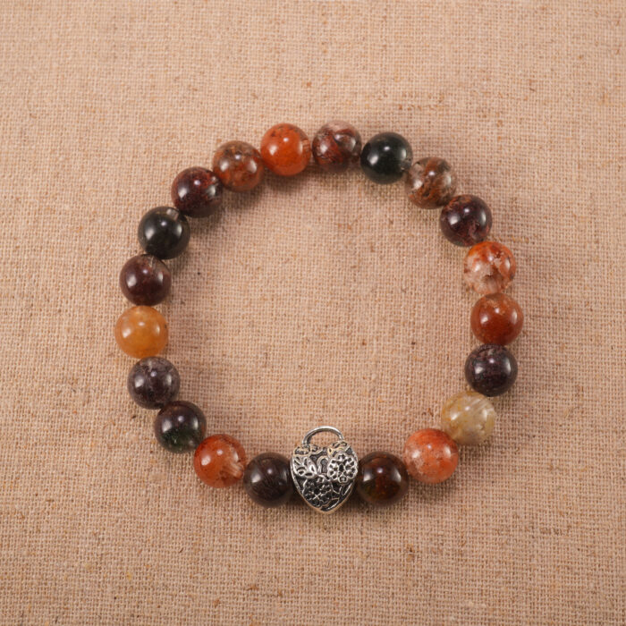 Handcrafted gemstone bracelet with Phantom Quartz beads and S925 silver clasp on clean background