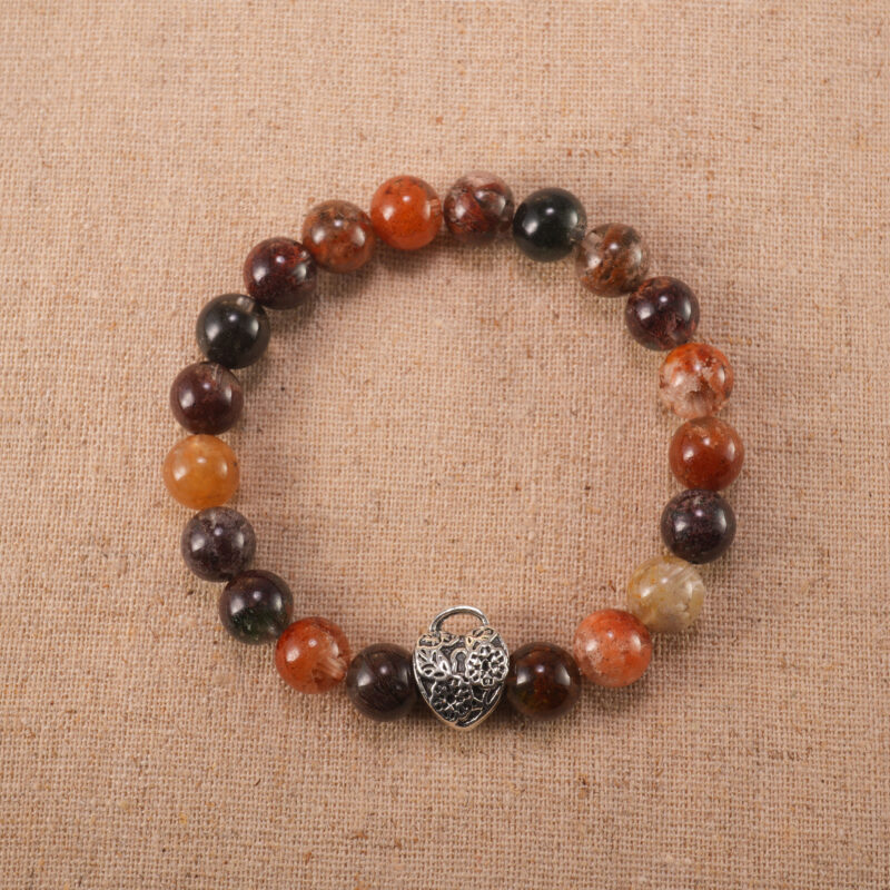 Handcrafted gemstone bracelet with Phantom Quartz beads and S925 silver clasp on clean background