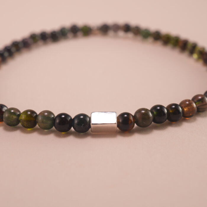 Close-up of natural black tourmaline beads and elastic threading