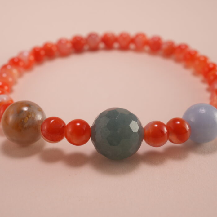 Close-up view of 4mm red and white chalcedony beads