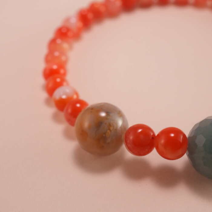 Close-up view of 4mm red and white chalcedony beads