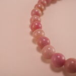 Close-up of Rhodochrosite Beads and Leaf Charm – Crystal Healing Bracelet for Love and Calm