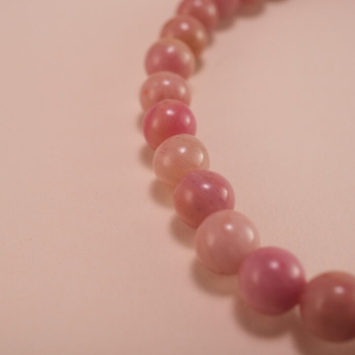 Close-up of Rhodochrosite Beads and Leaf Charm – Crystal Healing Bracelet for Love and Calm