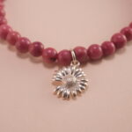Close-up of Rhodochrosite, Turquoise Beads and Flower Charm – Elegant Gemstone Charm Bracelet