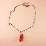 Handmade bloodstone pendant on dark or neutral background highlighting deep green with red flecks