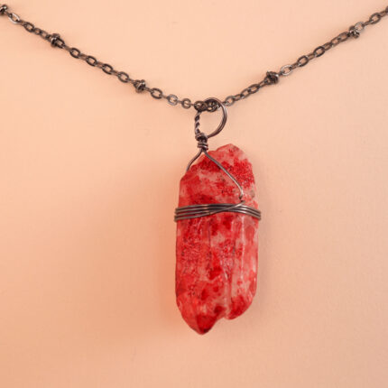 Close-up of polished bloodstone surface and pendant setting