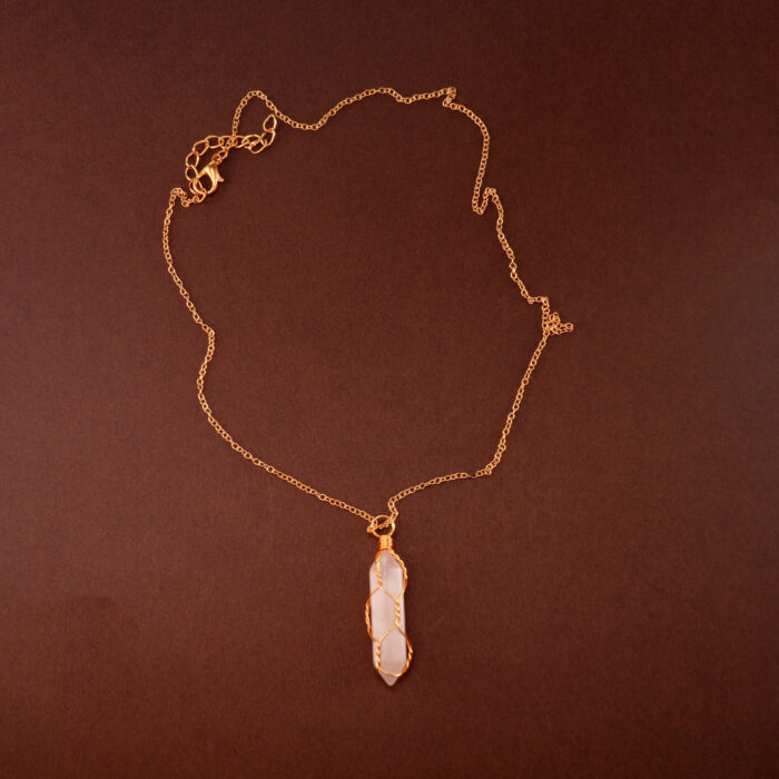 Handmade rose quartz point pendant necklace on a soft or white background