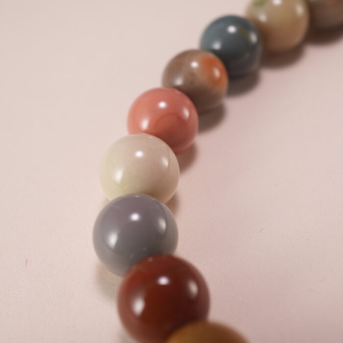 Wearing handmade beaded bracelet with sandalwood and Alashan stone