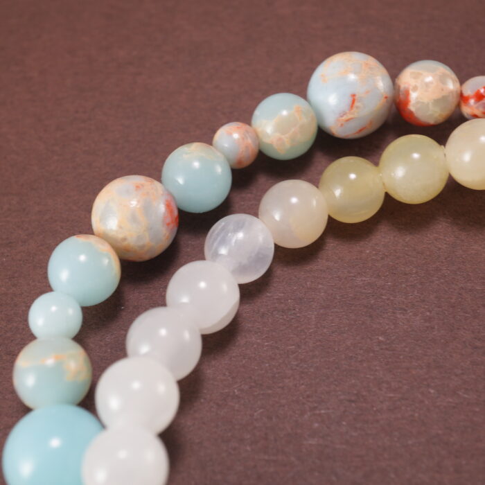 Close-up of gemstone textures and floral charm on chalcedony bracelet