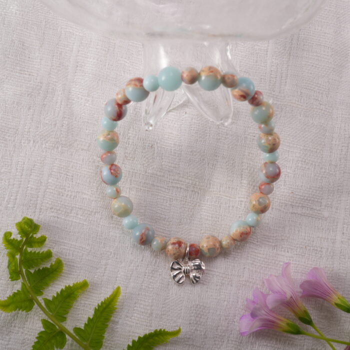 Bracelet placed in a serene, natural setting with soft lighting