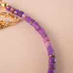 Detailed image of the bracelet showing the polished finish and small, elegant beads.