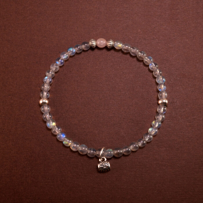 Handmade Chalcedony bracelet with floral and leaf charms, designed to promote restful sleep