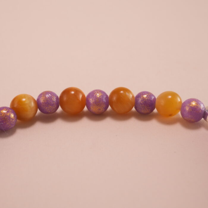 Close-up of Tiger Eye and Purple Chalcedony Beads with S925 Heart Charm
