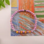 Tiger Eye and Chalcedony Bracelet placed in a serene natural setting with soft light