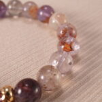 Detailed view of phantom amethyst textures and silver flower accent